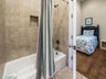 Tub shower combo in Jack and Jill guest bath