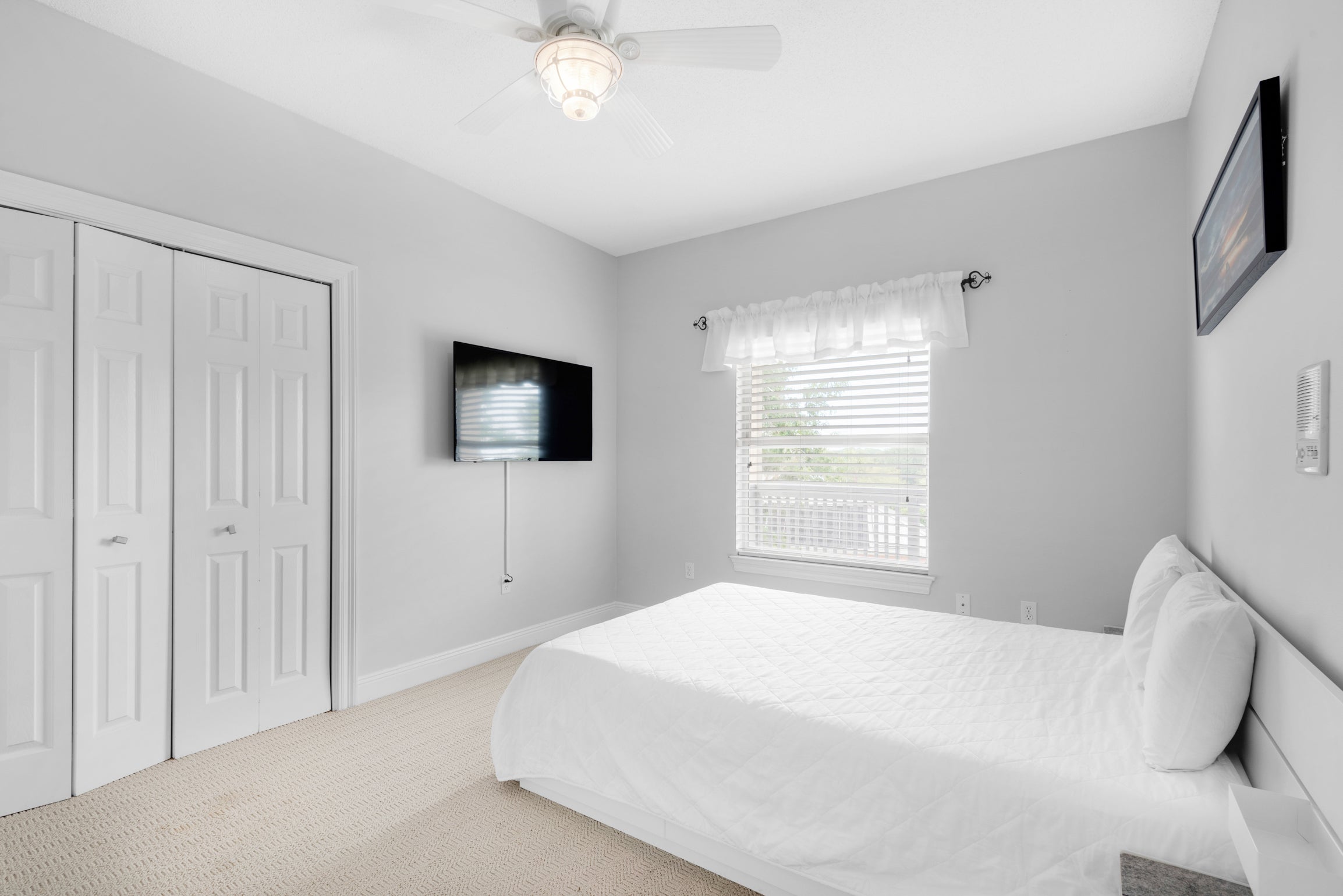 Guest bedroom with flat screen TV 