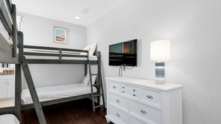 Bunk room with flat screen TV