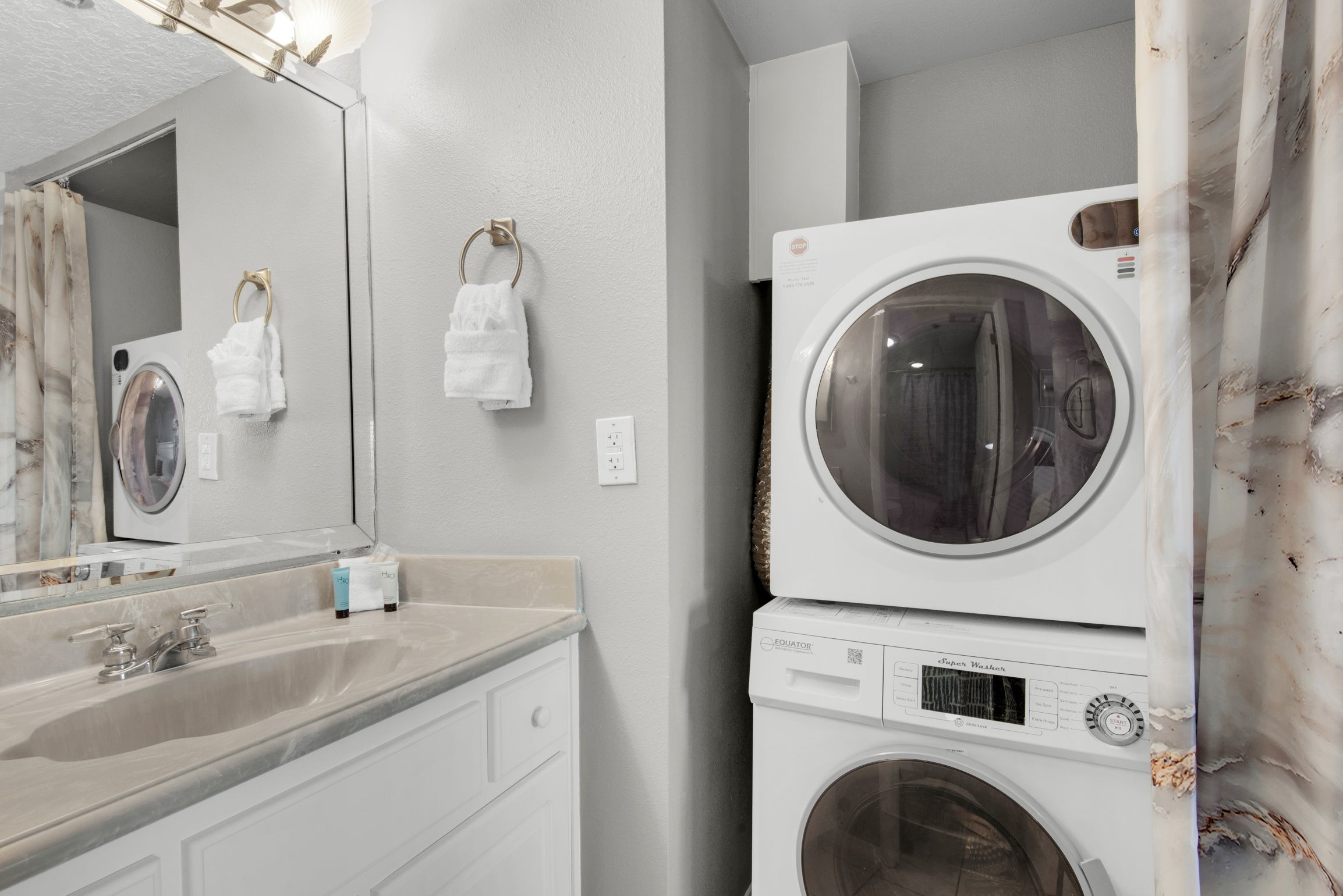 Guest bathroom with washer and dryer