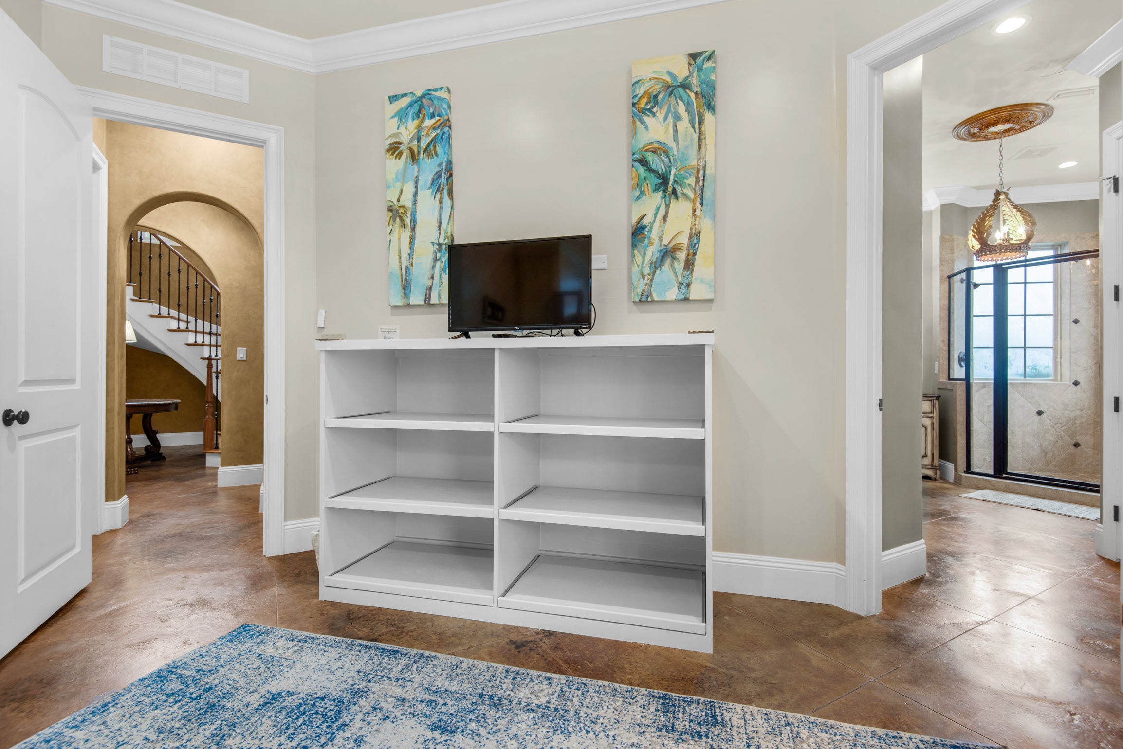 Custom Bunk room shelving for suitcases with smart tv