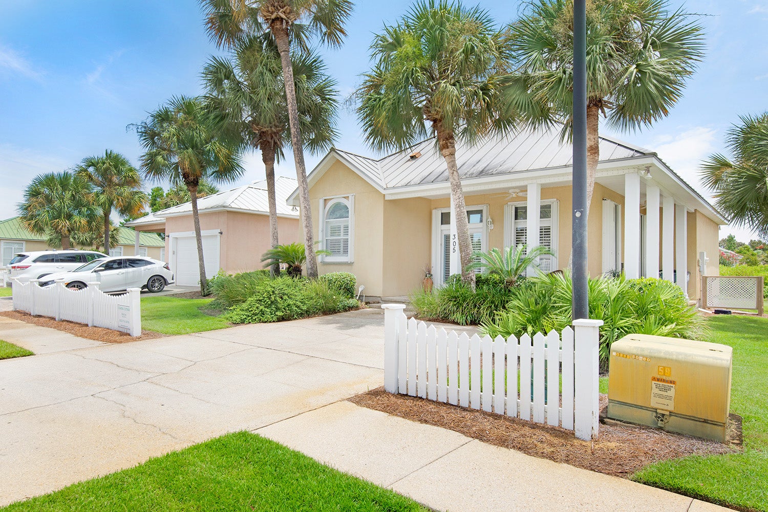 Beautifully landscaped and a white picket fence