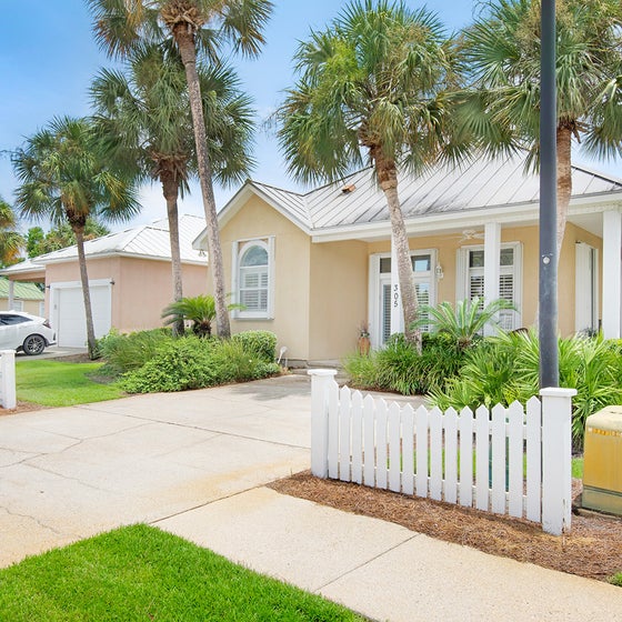 Beautifully landscaped and a white picket fence