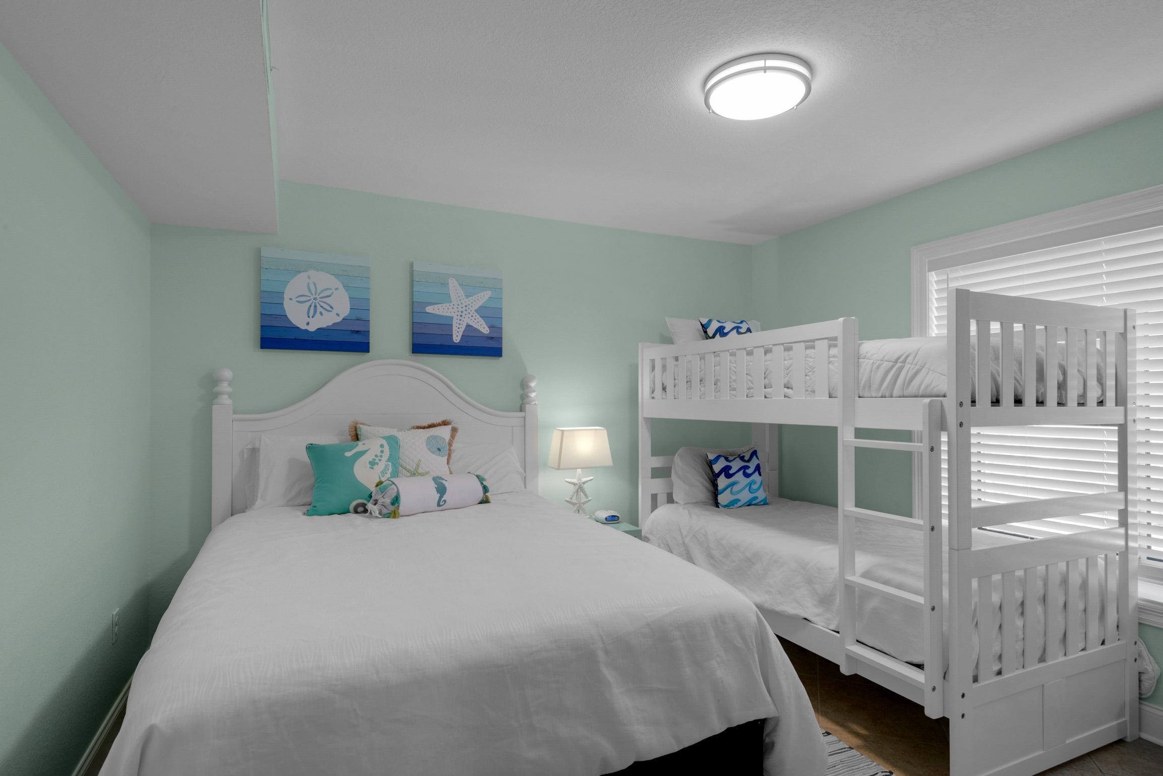 Guest bedroom with bed and bunk beds