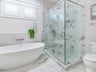 Soaking tub and glassed-in walk-in shower