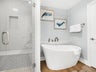 Walk-in shower and stand alone tub