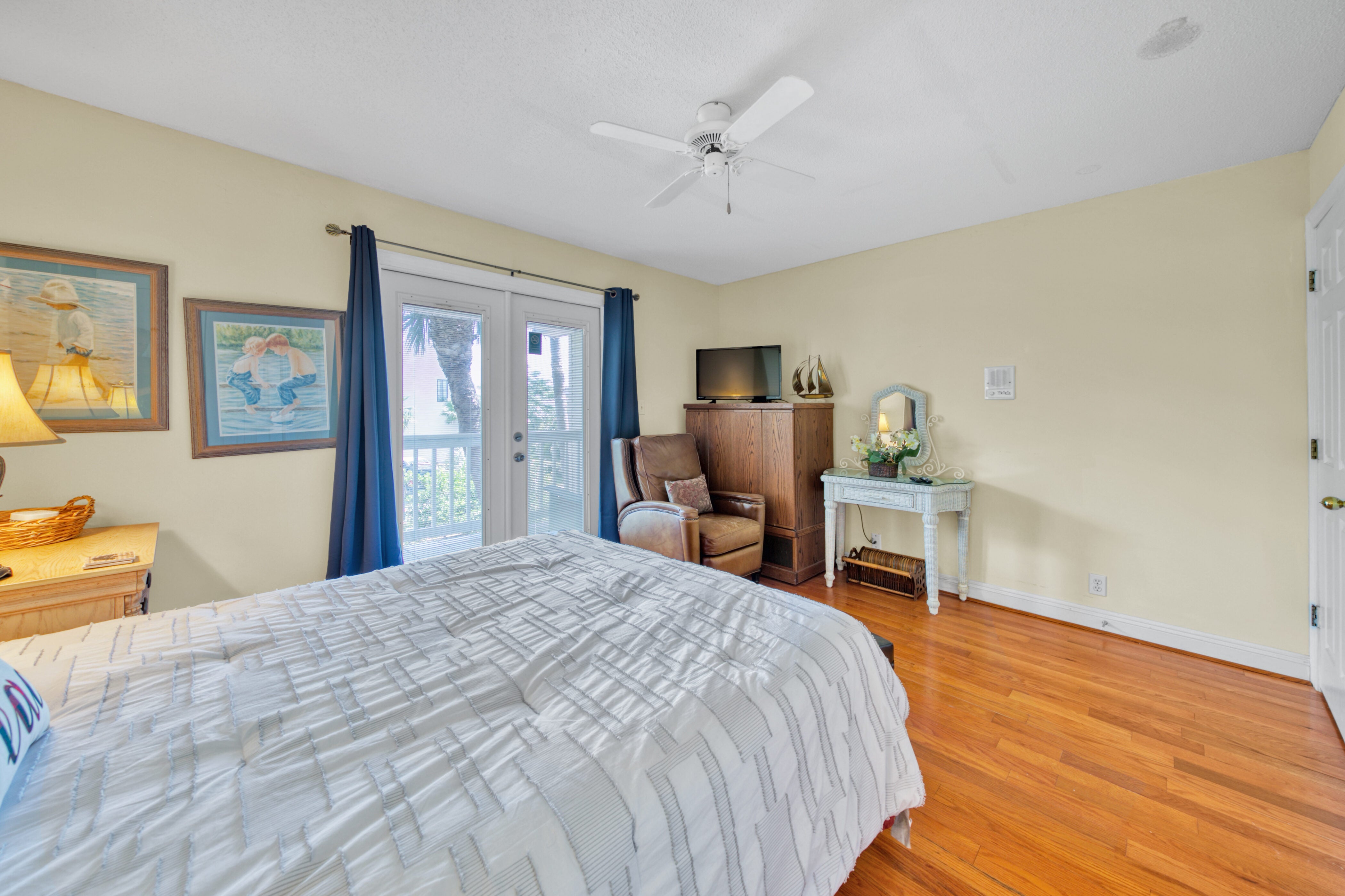 Guest bedroom with wood floors