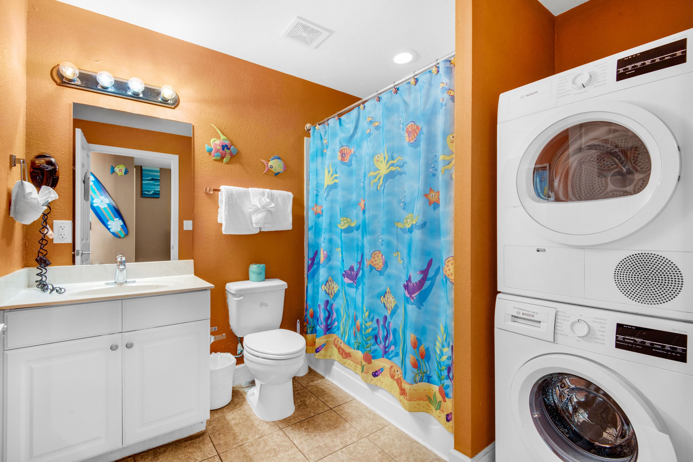 Guest bathroom with washer and dryer