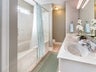 Dual sinks and shower-tub combo in Master Bath