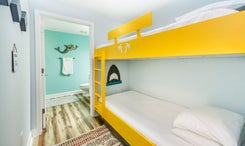 Bunk room with attached guest bathroom