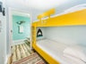 Bunk room with attached guest bathroom
