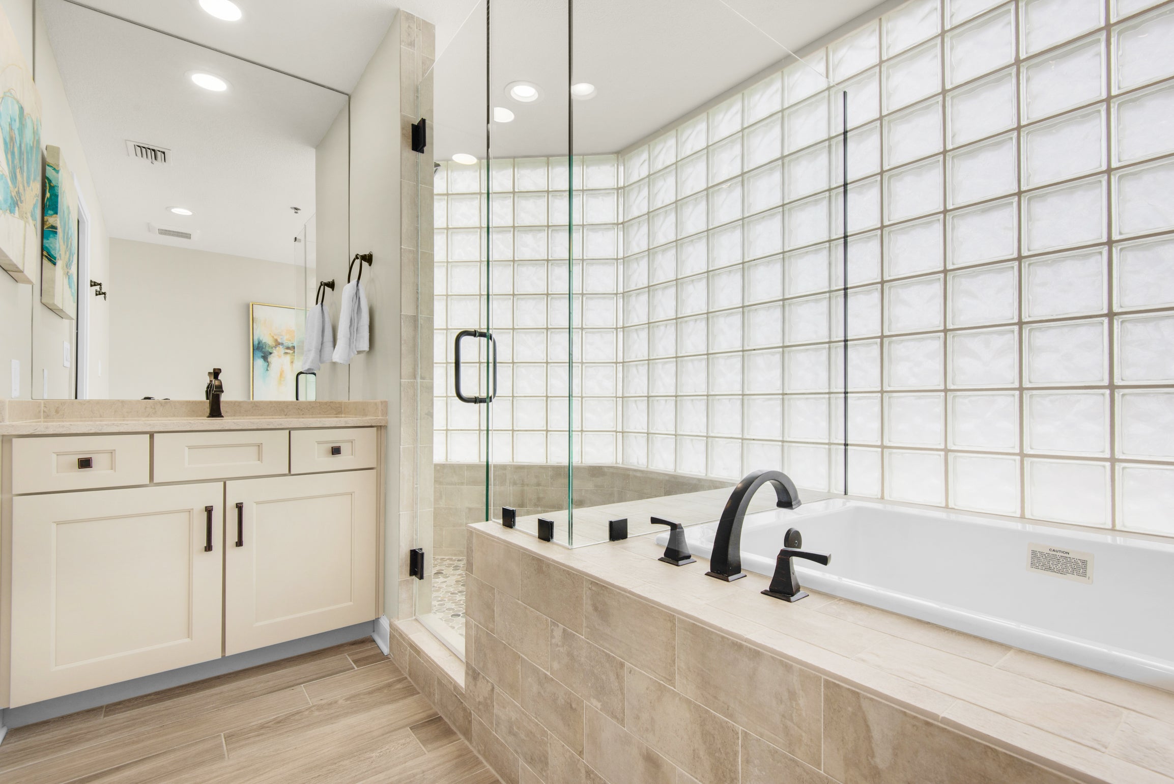 Master bathroom with walk-in shower and large tub