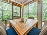 Dine in comfort on the screened deck