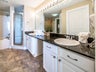 Double sinks in granite counters in large bath