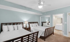Guest bedroom with 2 beds and guest bathroom