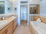 Jetted tub, dual sinks and walk-in shower