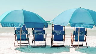 Beach chairs with umbrellas 