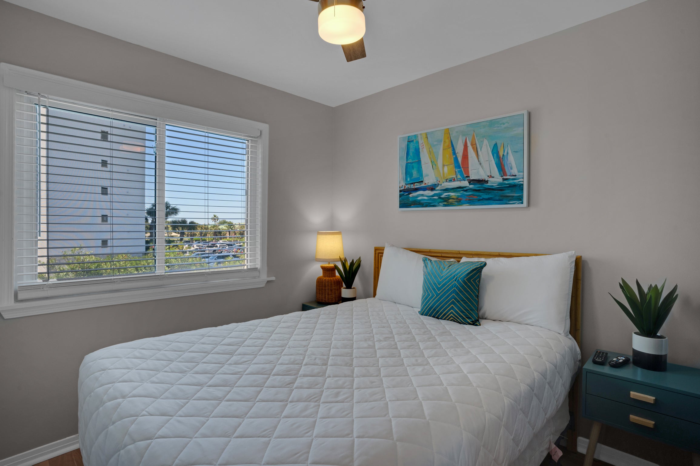 Second bedroom offers a queen bed and a view of the Gulf