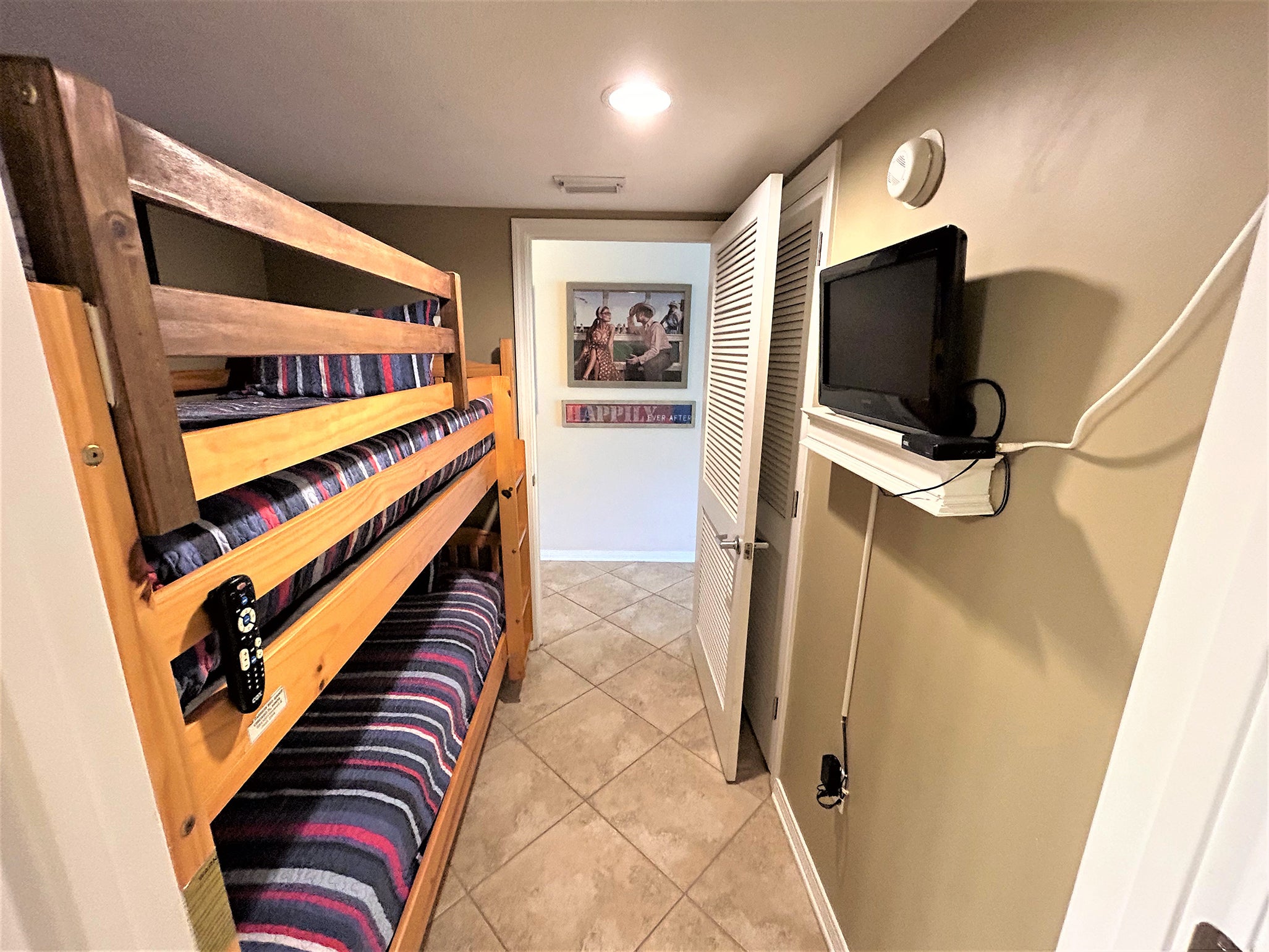 Bunk room with flat screen TV