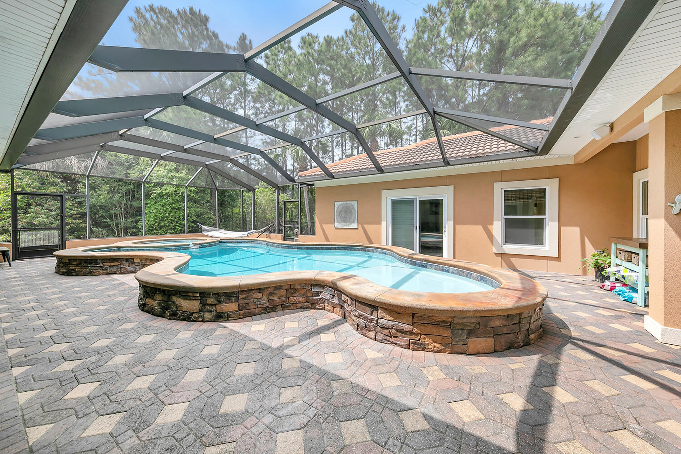 Screened in pool and hot tub