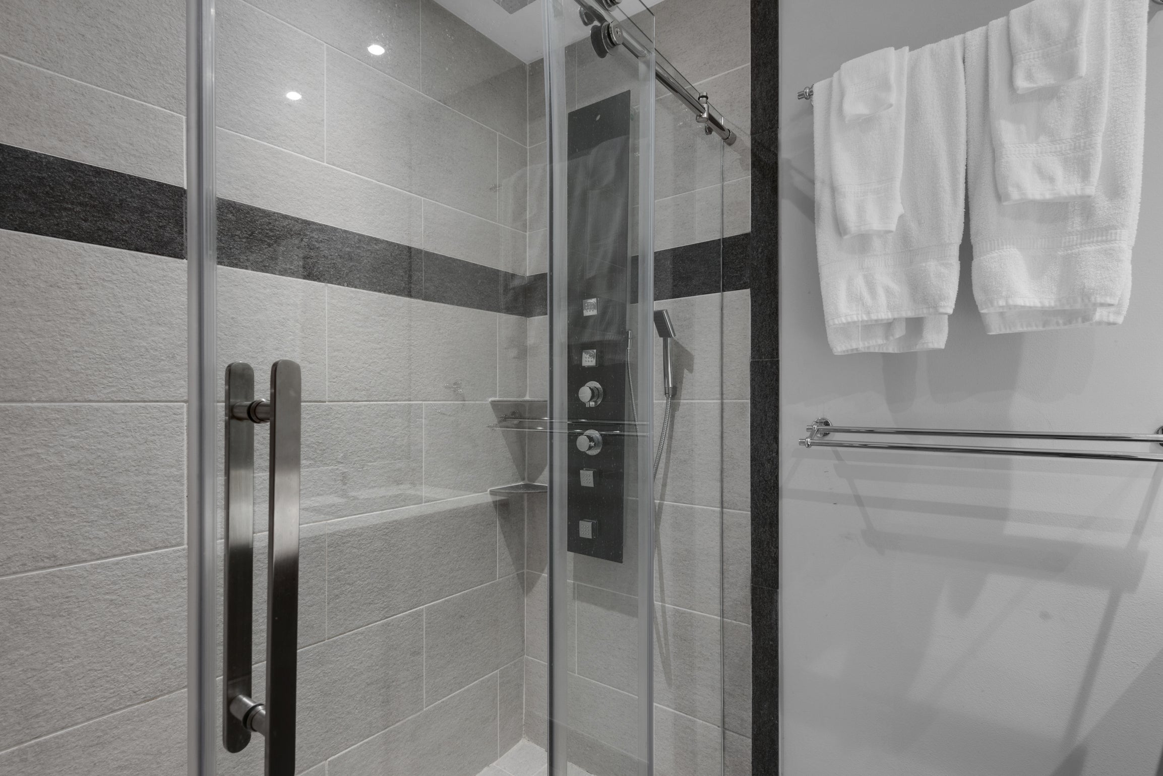 Master bath with rain shower and body massage jets
