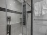 Master bath with rain shower and body massage jets