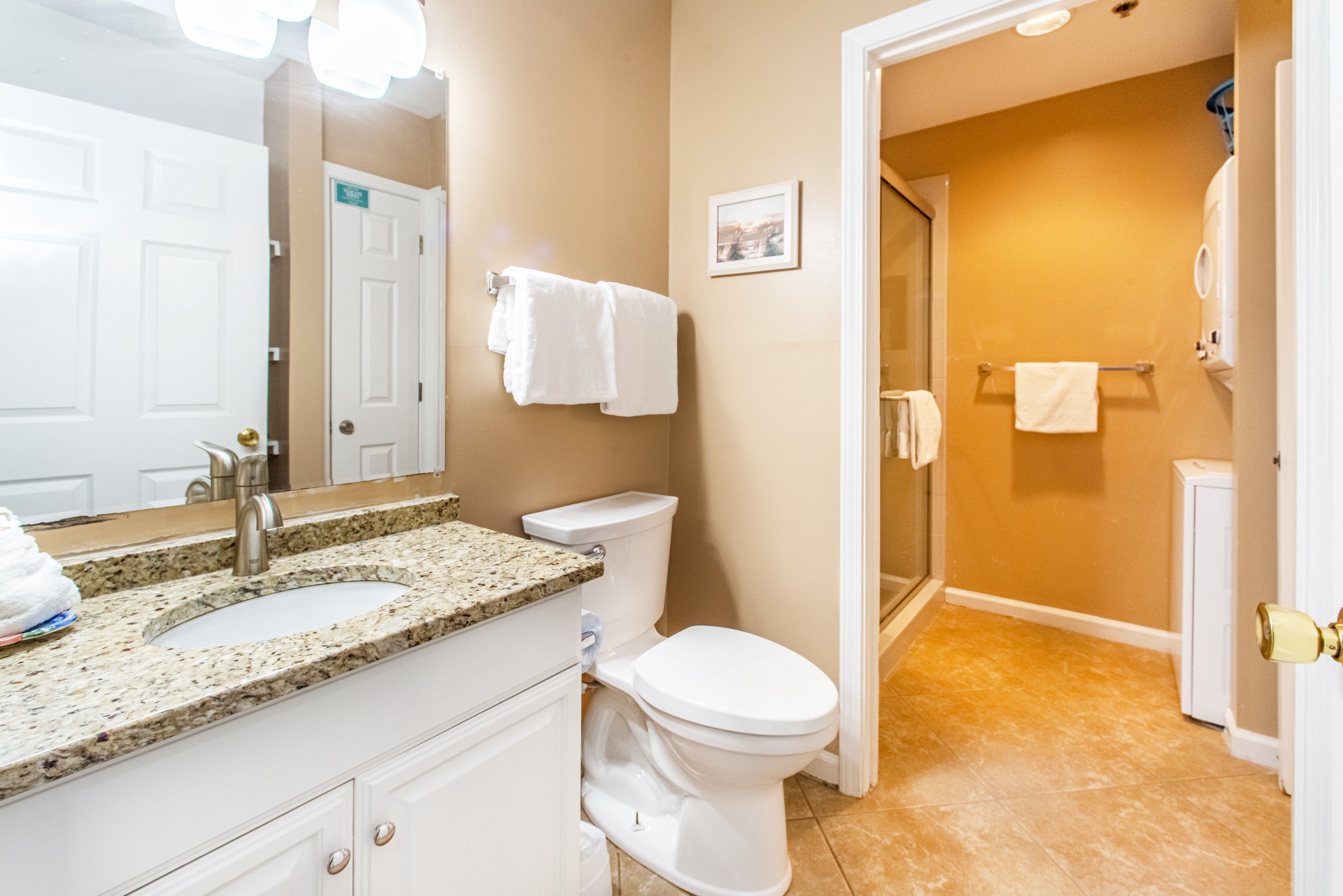 Guest bathroom with walk-in shower and laundry