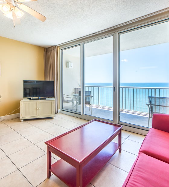 Living Area with balcony access and Flatscreen TV