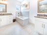 Dual vanities and soaking tub in Master Bath