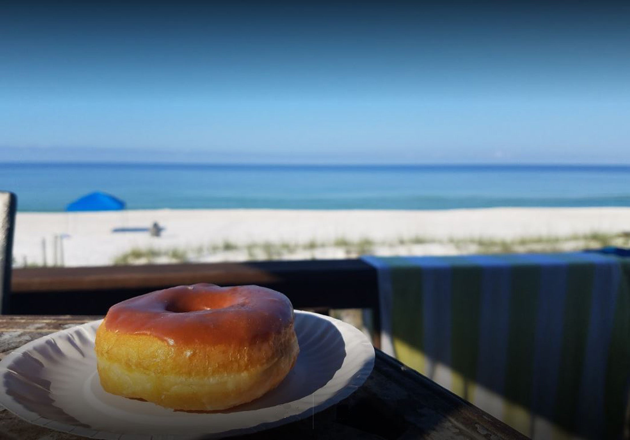 Wander 350 yards down the beach to Thomas Donuts