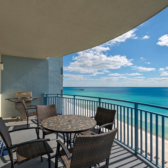 Enjoy a meal on this large balcony with grill!