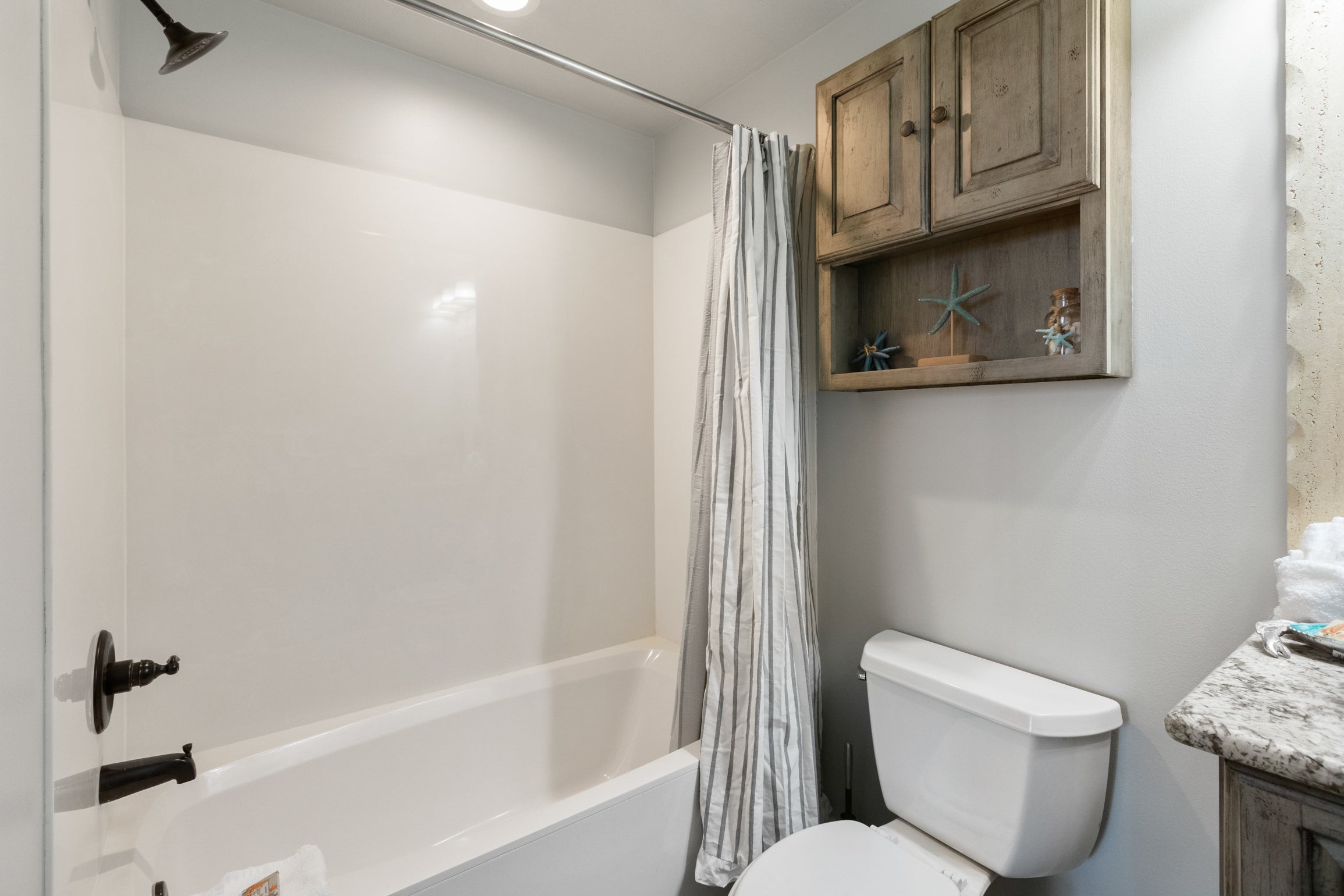 Shower-tub combo in Guest Bathroom