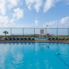 Laze by the Pool at Holiday Surf and Racquet Club