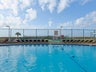 Laze by the Pool at Holiday Surf and Racquet Club