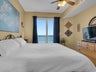 Master bedroom has balcony access and flat screen