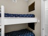 Bunk room with 2 TVs