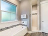 Large shower and soaking tub in master