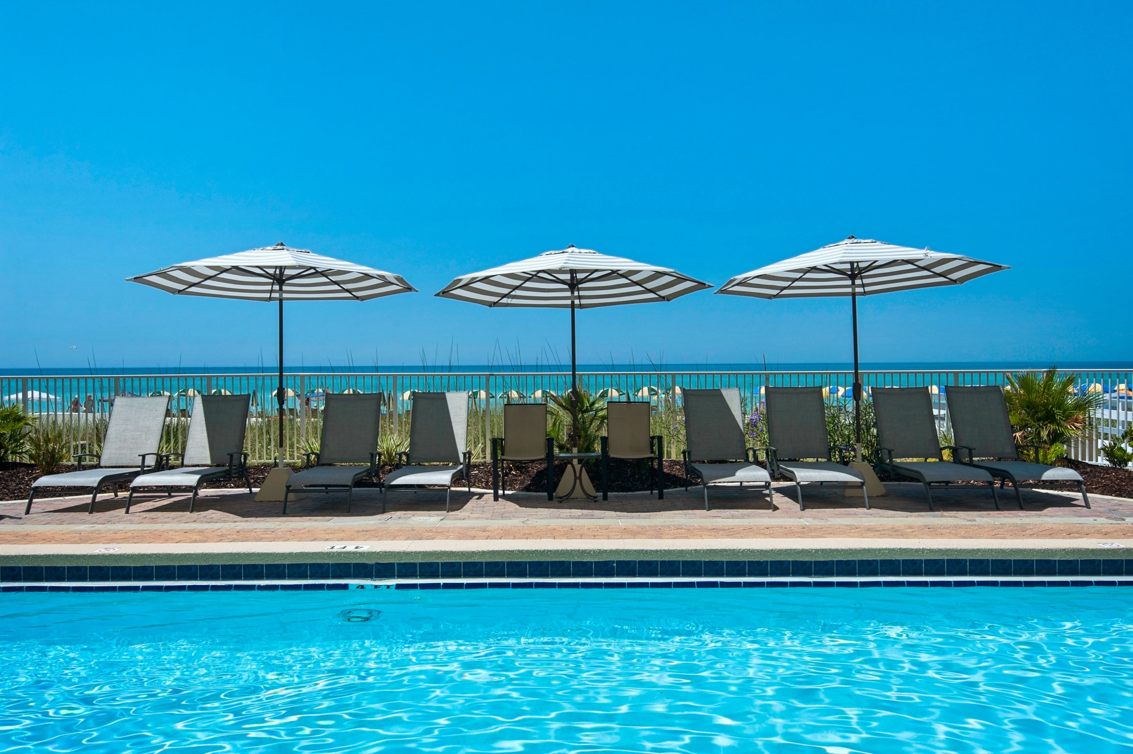 Relax by the pool and enjoy the gulf views