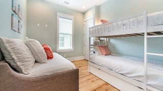 Guest bedroom with bunk bed and additional bed
