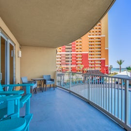 Step out on the balcony with pool and ocean views!