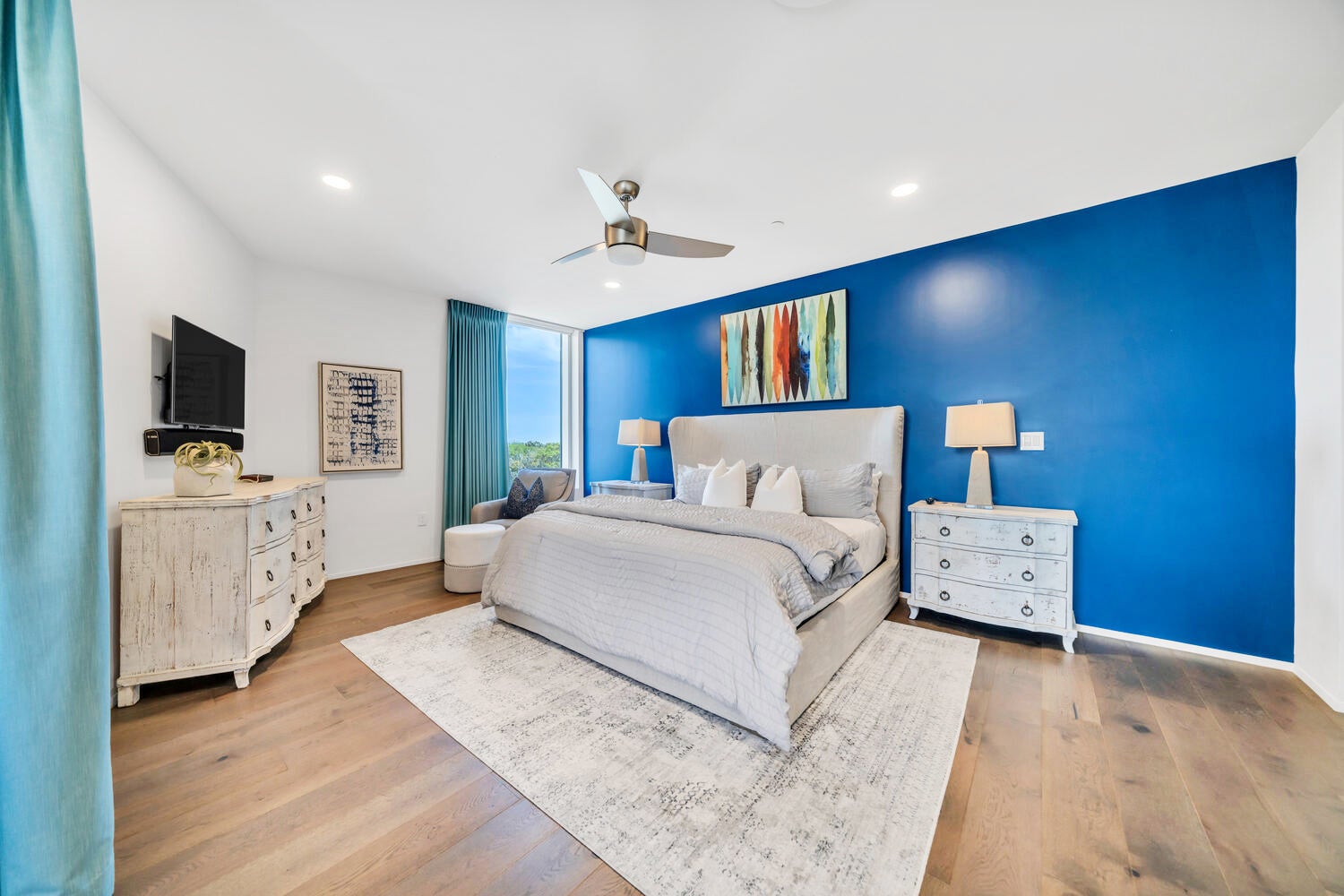 Guest bedroom with blue accent wall