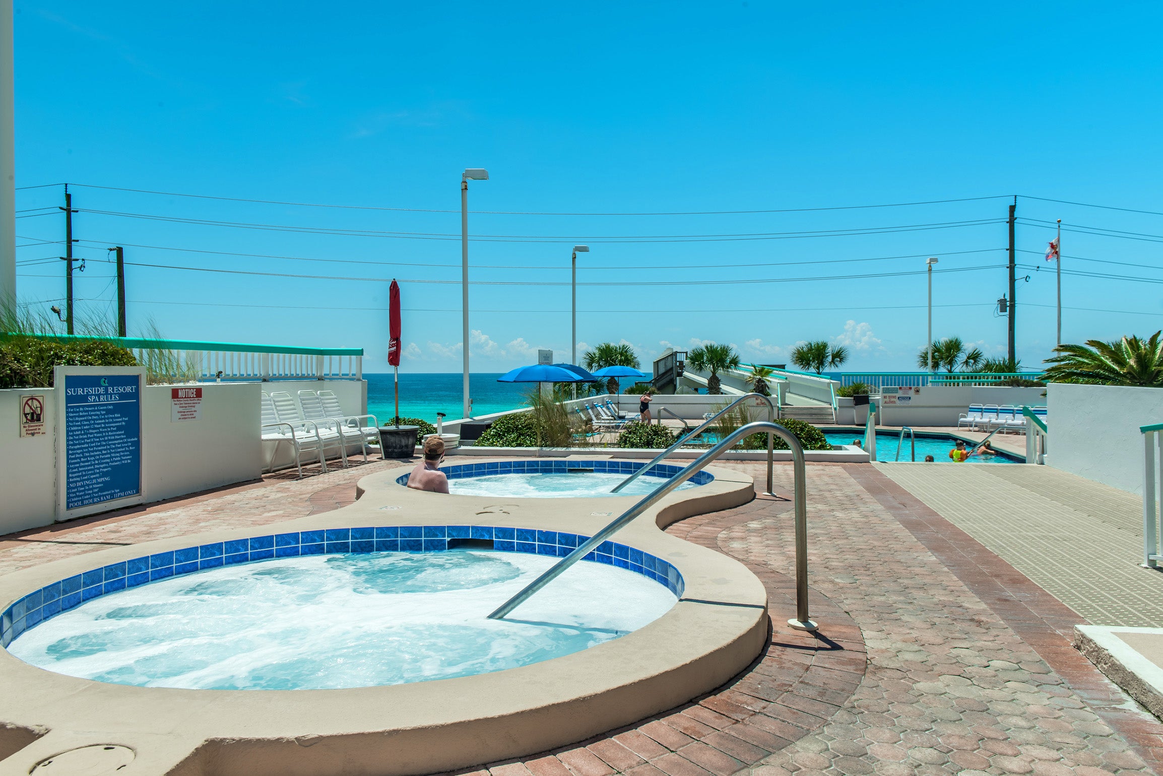 Dual hot tubs and pool at Surfside