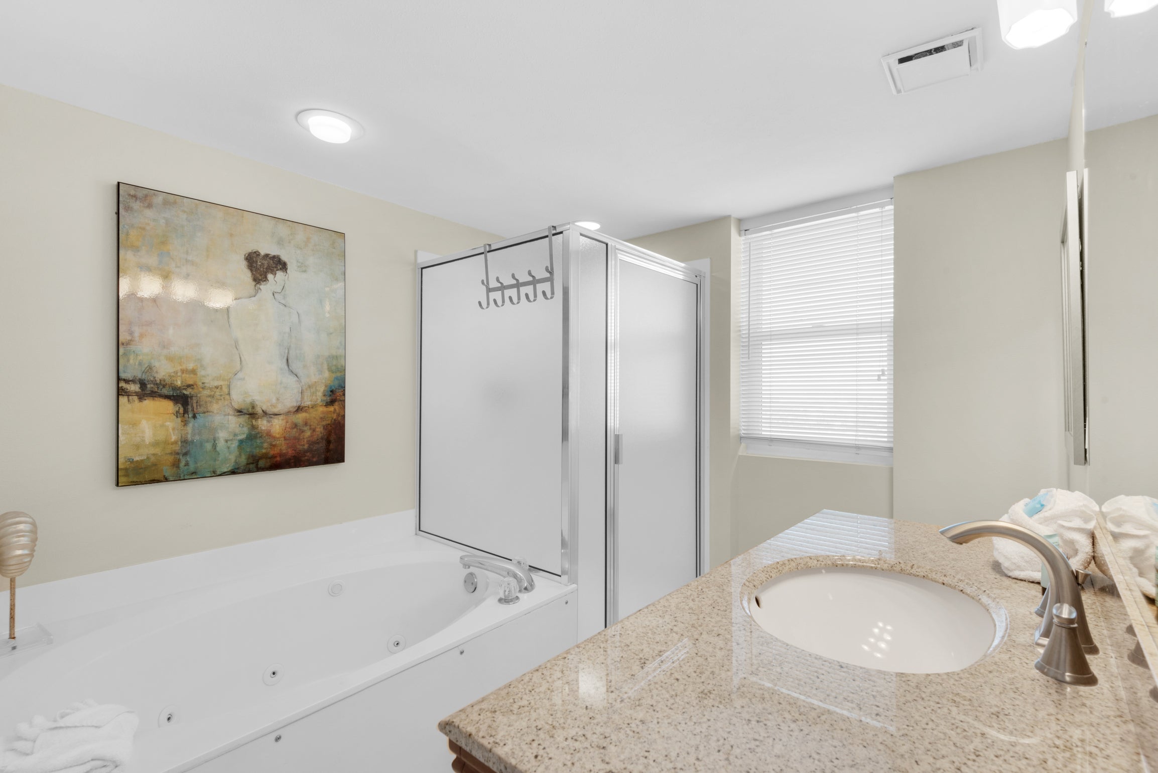 Master bathroom with tub and walk-in shower