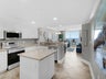 Kitchen island and stainless steel appliances