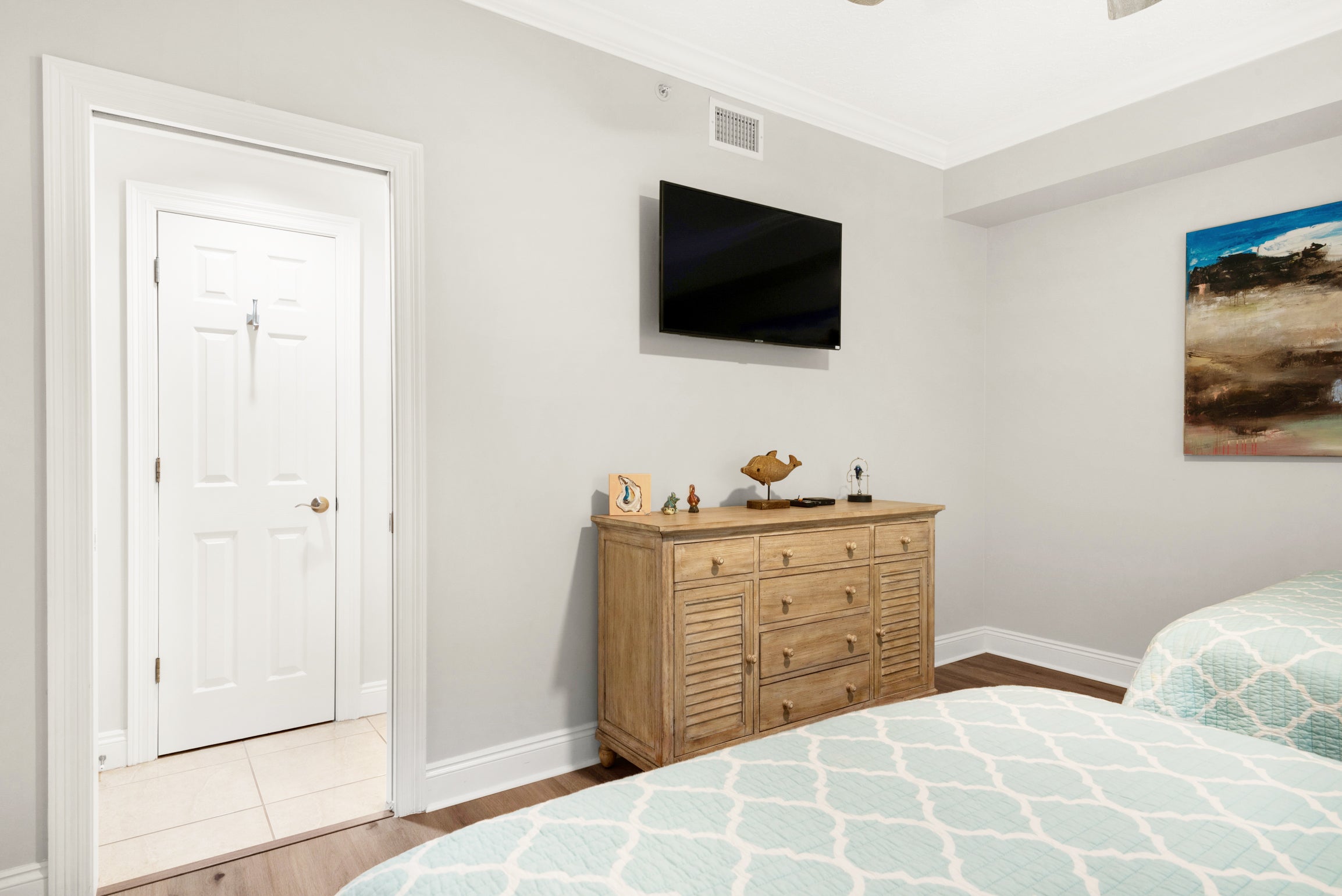 Guest bedroom with 2 beds and flat screen TV